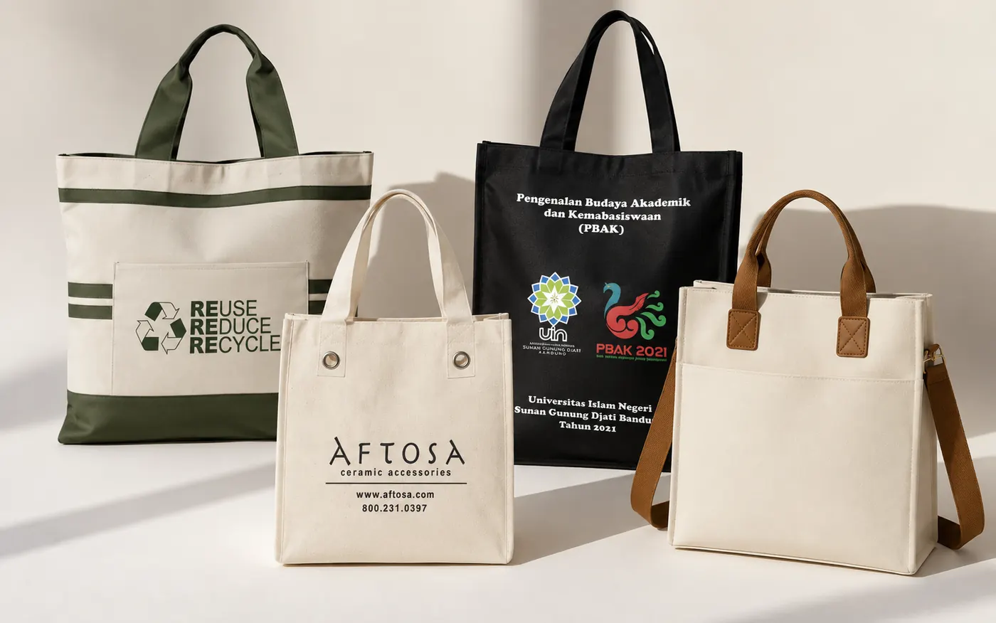 A collection of custom tote bags in different materials, colors, and handle styles